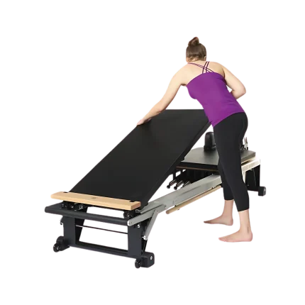 Merrithew Mat Converter installed on a V2 Max Reformer in a Dubai Pilates studio, showcasing its raised platform and comfortable surface. Buy Pilates accessories UAE