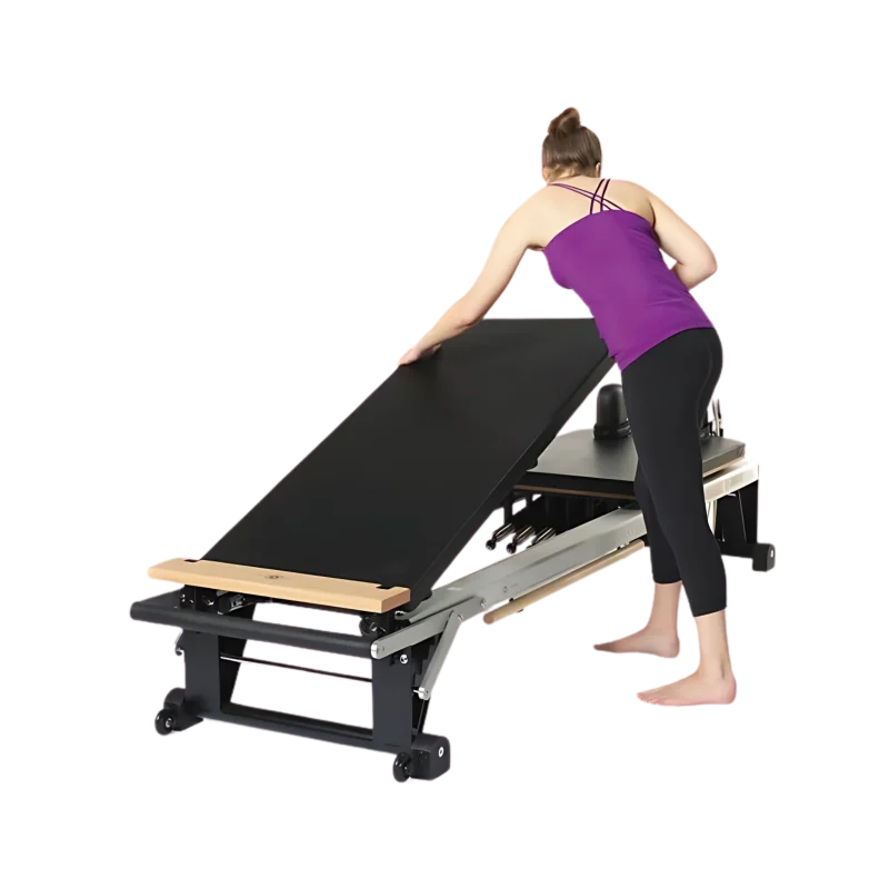 Merrithew Mat Converter installed on a V2 Max Reformer in a Dubai Pilates studio, showcasing its raised platform and comfortable surface. Buy Pilates accessories UAE