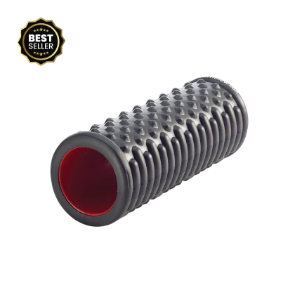 The Merrithew Massage Point Foam Roller (15 inch) displayed in a bright Dubai fitness studio, showcasing its textured surface and vibrant red core, ideal for myofascial release in the UAE.