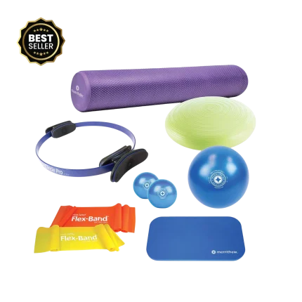 The complete Merrithew Pilates Essentials Kit laid out on an eco-friendly Pilates mat in a bright studio setting in Dubai, showcasing all the included props for a comprehensive Pilates workout in the UAE.